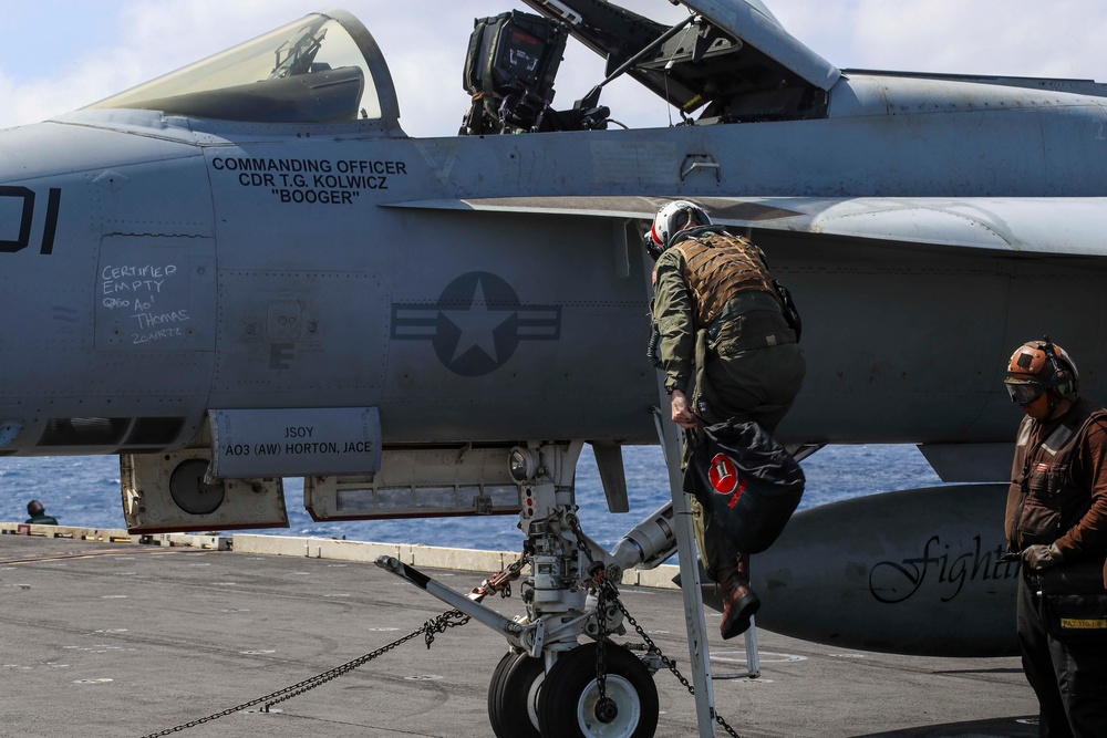 Abraham Lincoln holds an in-flight change of command ceremony for VFA-14