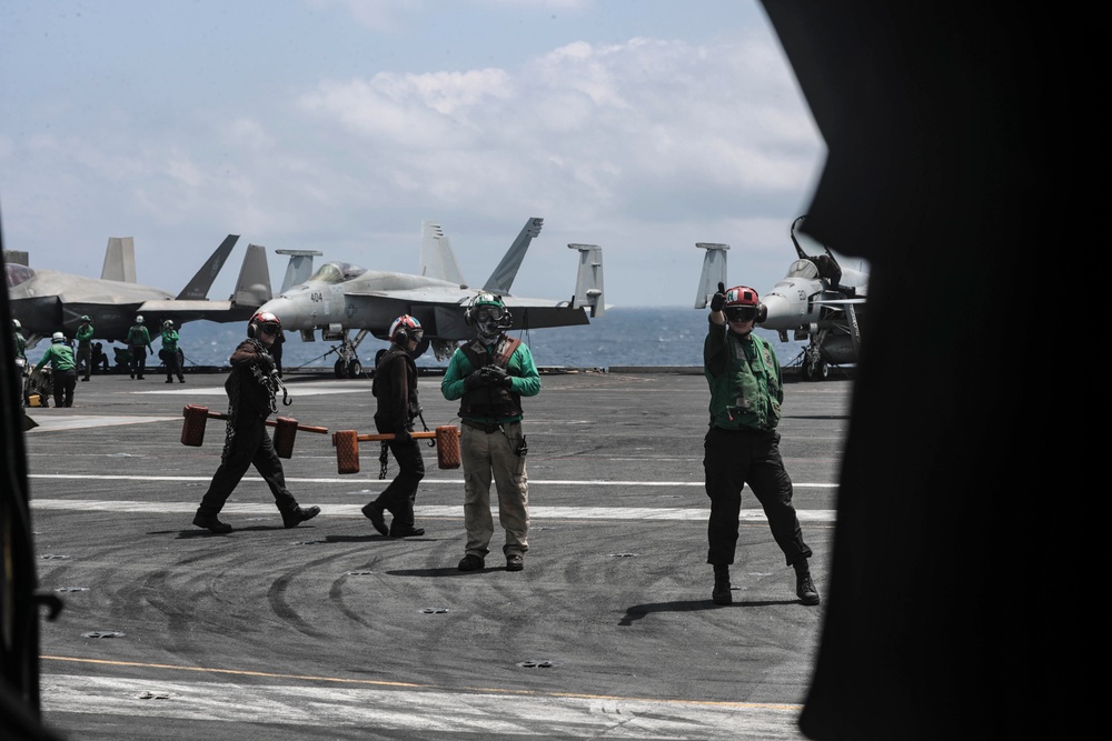 Abraham Lincoln holds an in-flight change of command ceremony for VFA-14