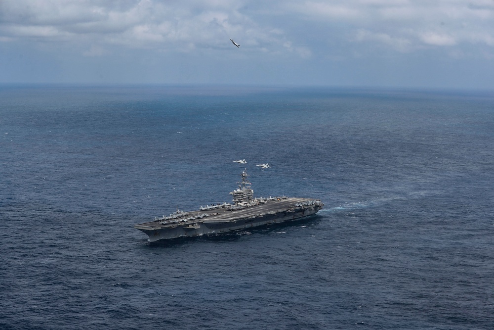 Abraham Lincoln holds an in-flight change of command ceremony for VFA-14