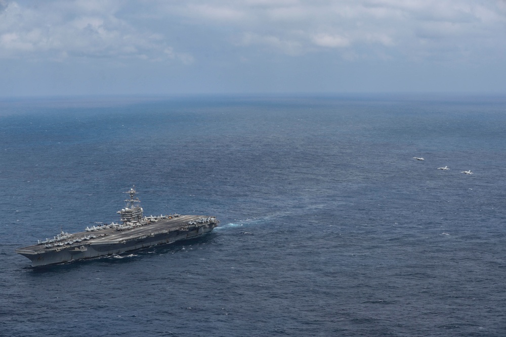 Abraham Lincoln holds an in-flight change of command ceremony for VFA-14