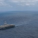 Abraham Lincoln holds an in-flight change of command ceremony for VFA-14