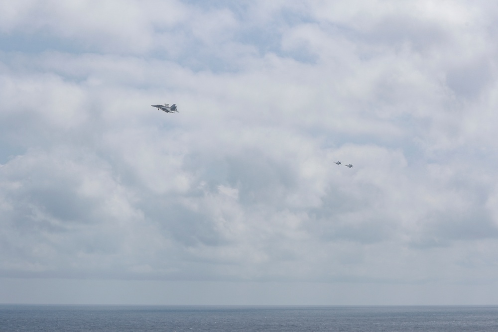 Abraham Lincoln holds an in-flight change of command ceremony for VFA-14