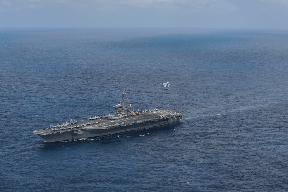 Abraham Lincoln holds an in-flight change of command ceremony for VFA-14