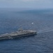 Abraham Lincoln holds an in-flight change of command ceremony for VFA-14