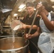 Abraham Lincoln Sailors serve food