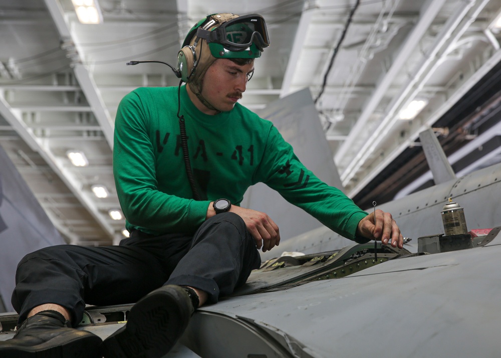 Abraham Lincoln Sailors conduct aircraft maintenance