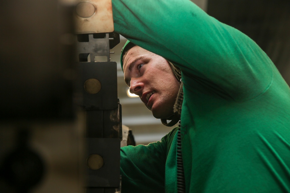 Abraham Lincoln Sailors conduct aircraft maintenance