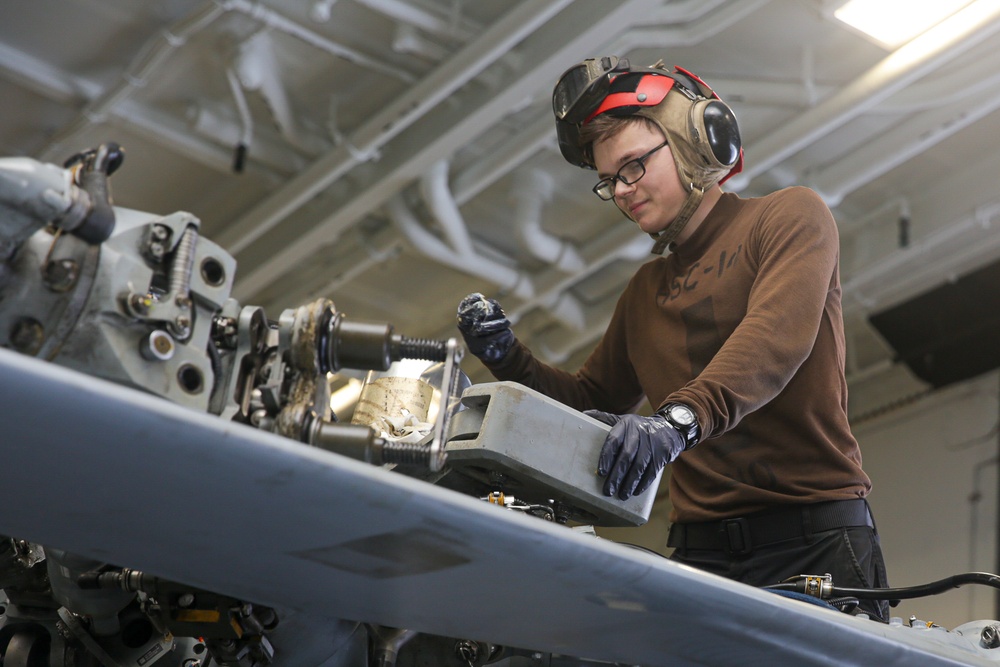 Abraham Lincoln Sailors conduct aircraft maintenance