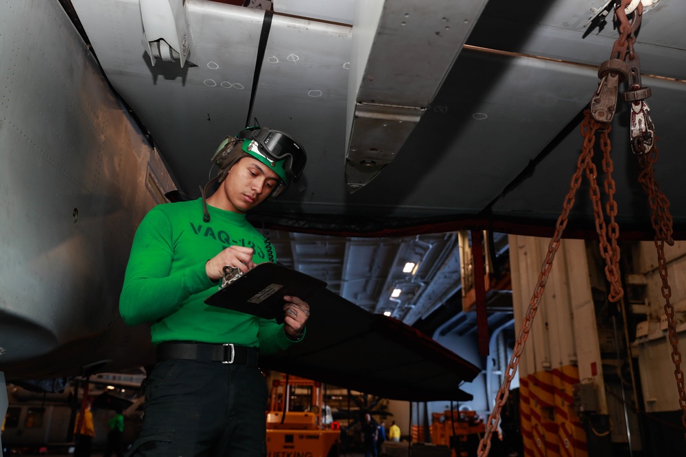 Abraham Lincoln Sailors conduct aircraft maintenance