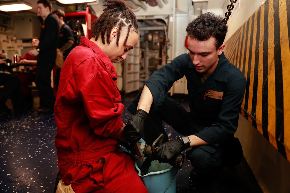 Abraham Lincoln Sailors conduct aircraft maintenance