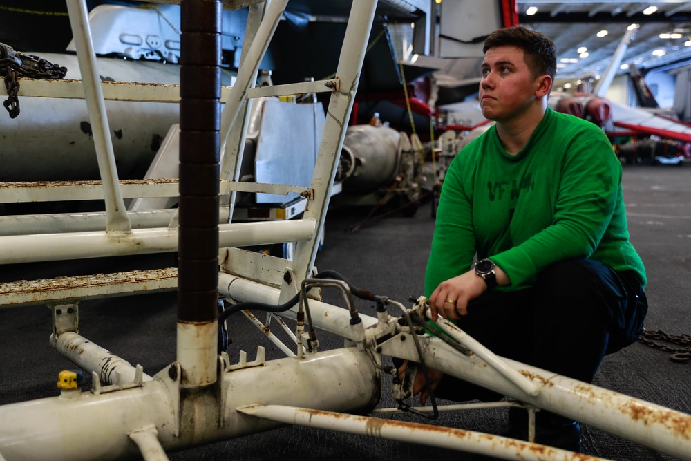 Abraham Lincoln Sailors conduct aircraft maintenance