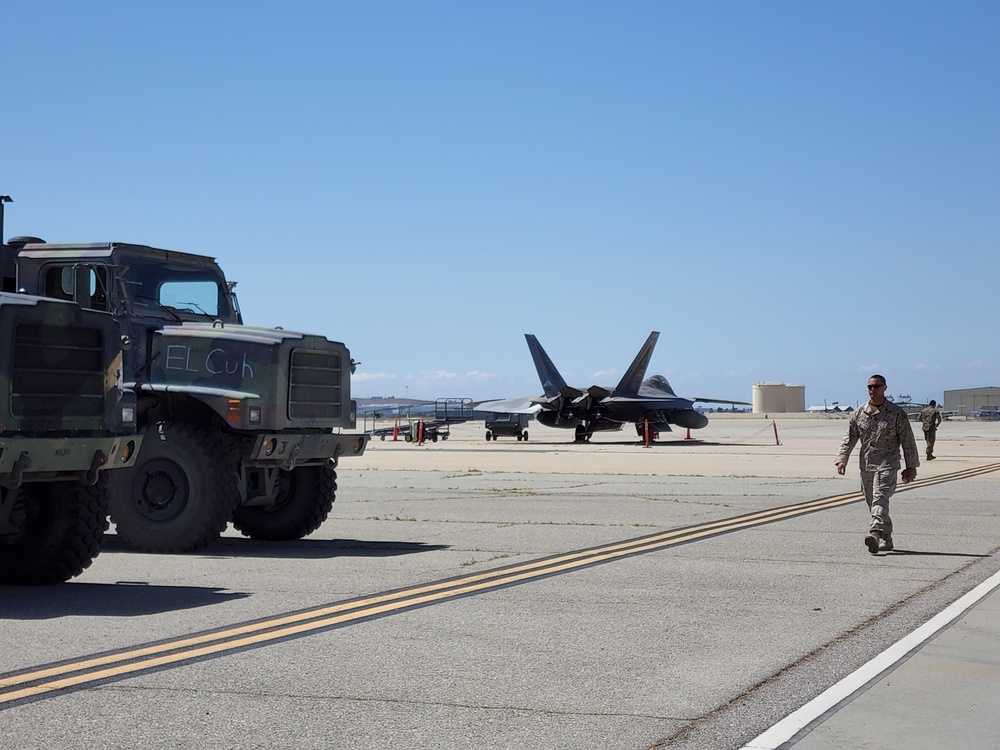 Marine walks by F-22 and MRTVS