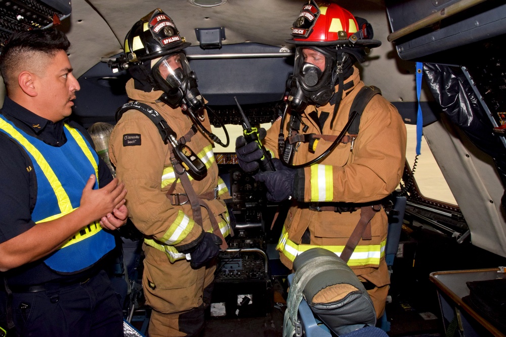 Reserve Citizen Airmen and JBSA firefighters practice C-5M emergency procedures