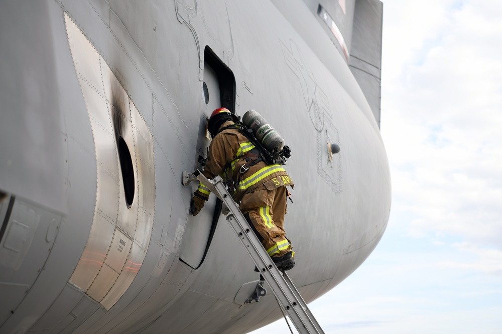 Reserve Citizen Airmen and JBSA firefighters practice C-5M emergency procedures