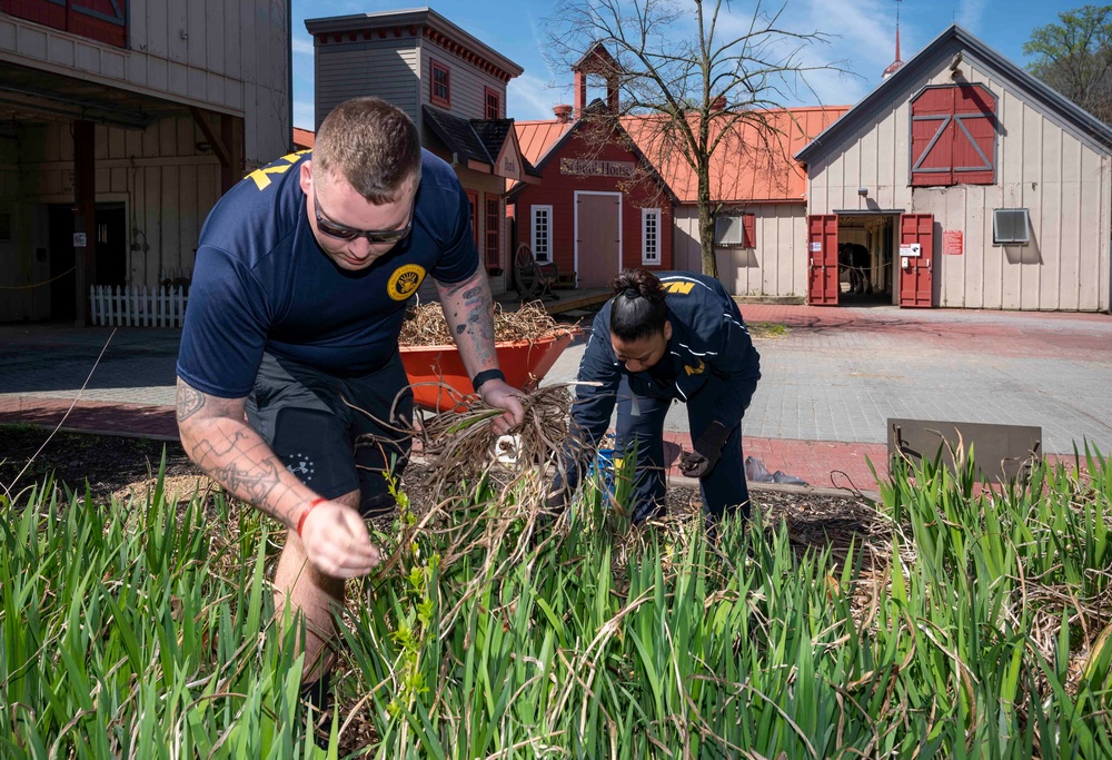 Sailors participate in the Earth Day community cleanup