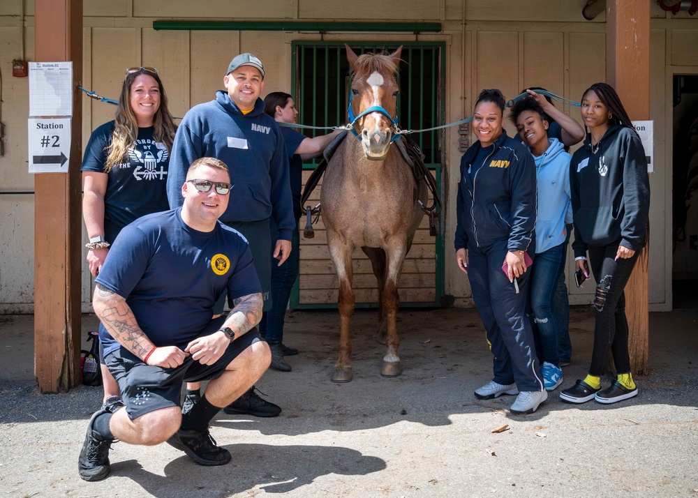 Sailors participate in the Earth Day community cleanup
