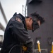 Sailor grinds paint aboard USS Carl Vinson (CVN 70)