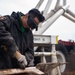 Sailor grinds paint aboard USS Carl Vinson (CVN 70)