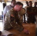 Staff Sgt. Matthew Sprague teaches a class on room clearing to members of the Forces Armées Nigériennes during the Basic Training Enhancement Program