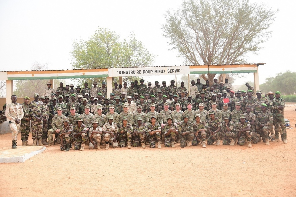 Instructors and graduates from the Basic Training Enhancement Program at graduation