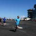 Abraham Lincoln Sailors run on the flight deck