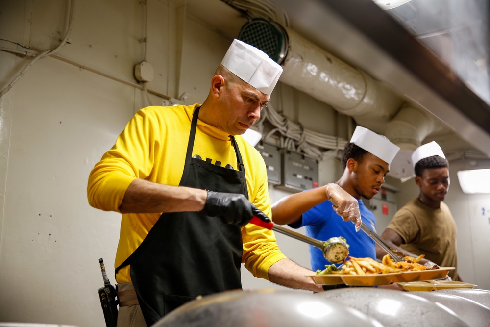 Abraham Lincoln CMC serves food