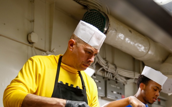 Abraham Lincoln CMC serves food