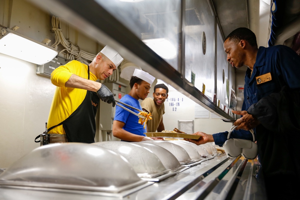 Abraham Lincoln CMC serves food