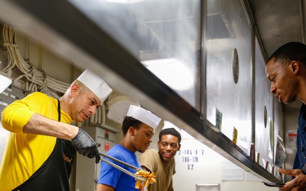 Abraham Lincoln CMC serves food
