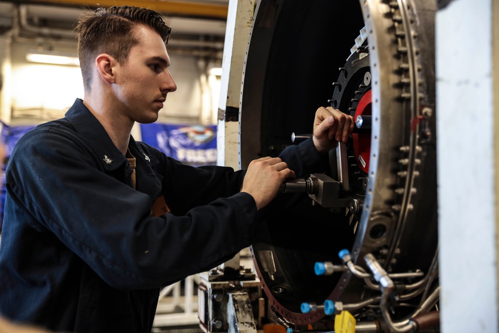 Abraham Lincoln Sailors conduct aircraft maintenance