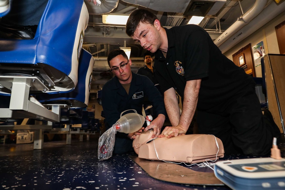 Sailors conduct CPR training aboard Mobile Bay