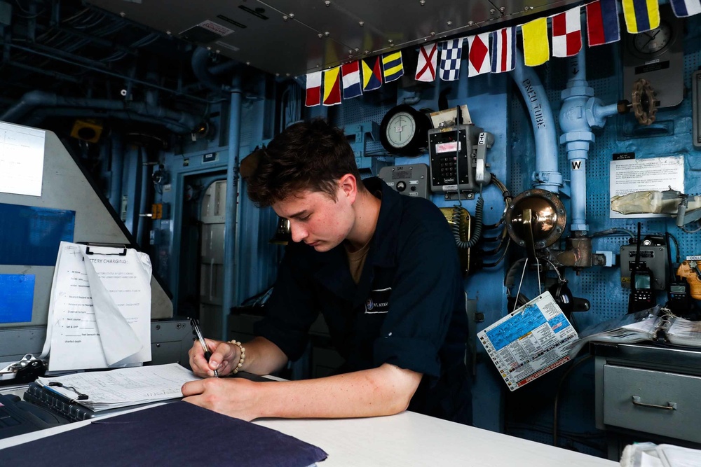 Sailors aboard the Mobile Bay navigate the Philippine Sea