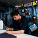 Sailors aboard the Mobile Bay navigate the Philippine Sea