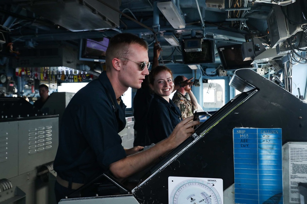 Sailors aboard the Mobile Bay navigate the Philippine Sea