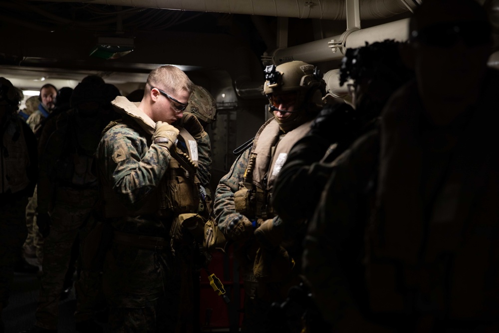 USS Arlington conducts flight operations with Royal Marines