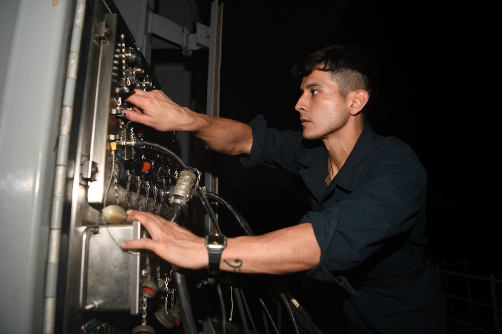 Abraham Lincoln Sailors run an engine test