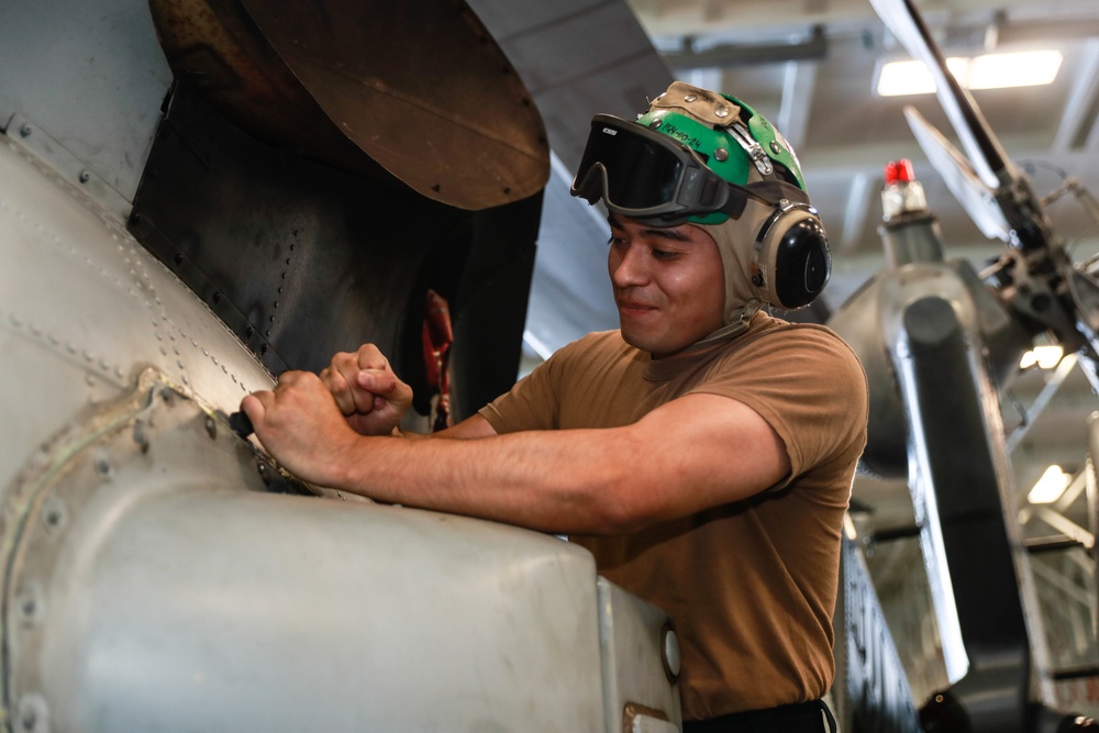 Abraham Lincoln Sailors conduct aircraft maintenance