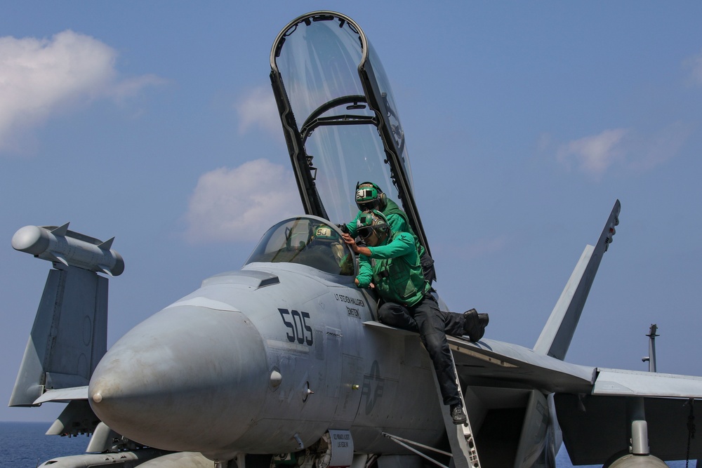 Abraham Lincoln Sailors conduct aircraft maintenance