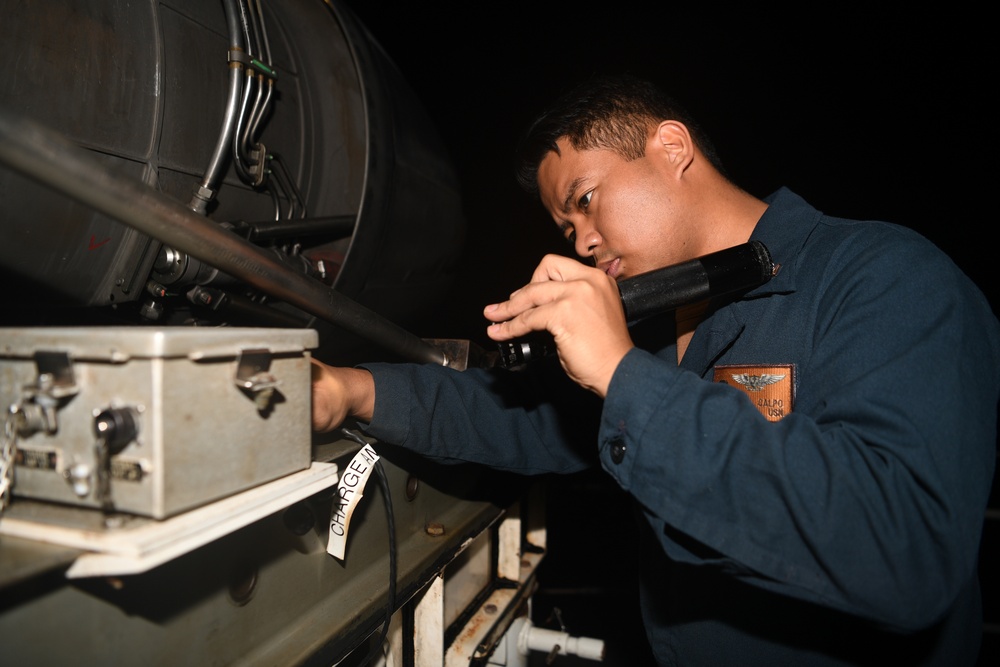 Abraham Lincoln Sailors run an engine test