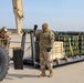 Col. John B. Mountford Visits with 1st Cavalry Division Ammunitions Specialists at Aerial Gunnery