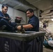 Abraham Lincoln Sailors conduct inventory