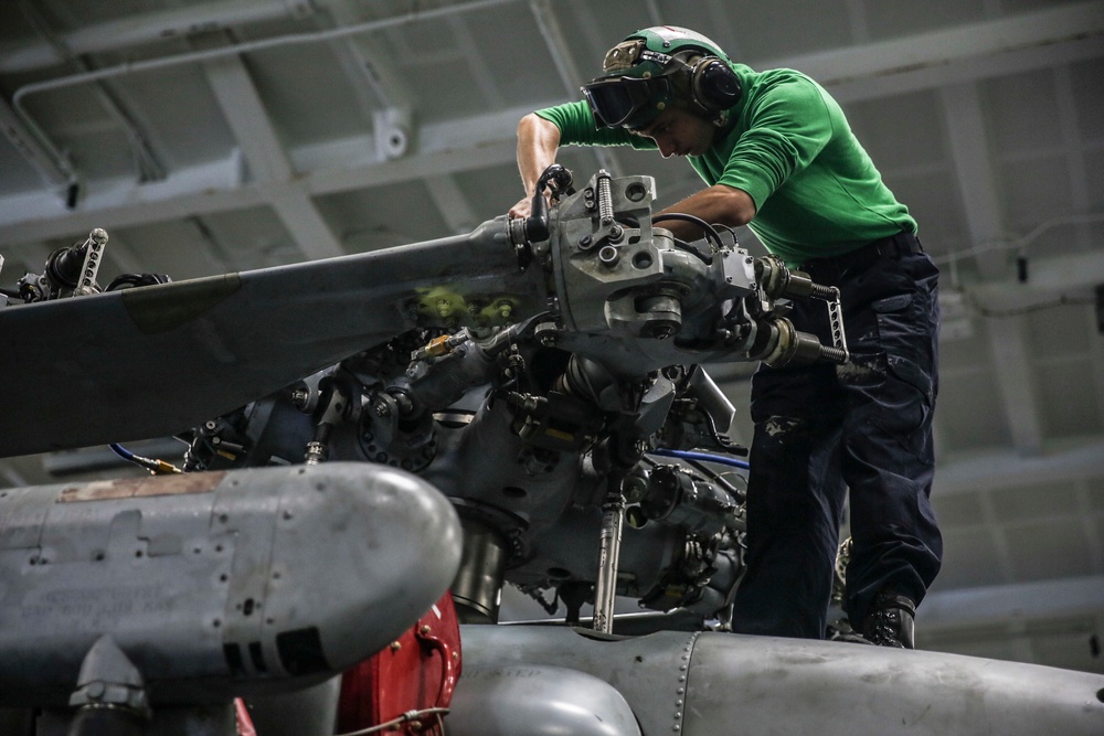 Abraham Lincoln Sailors conduct aircraft maintenance