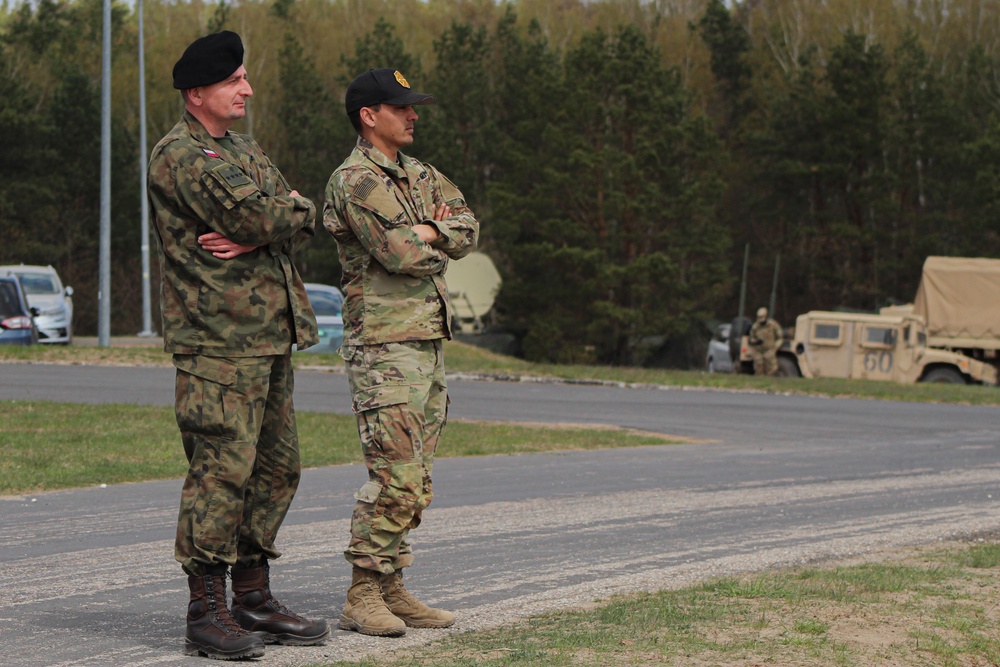 Polish and U.S. Soldiers Watch a Combined Arms Breach During Abrams Operation Summit