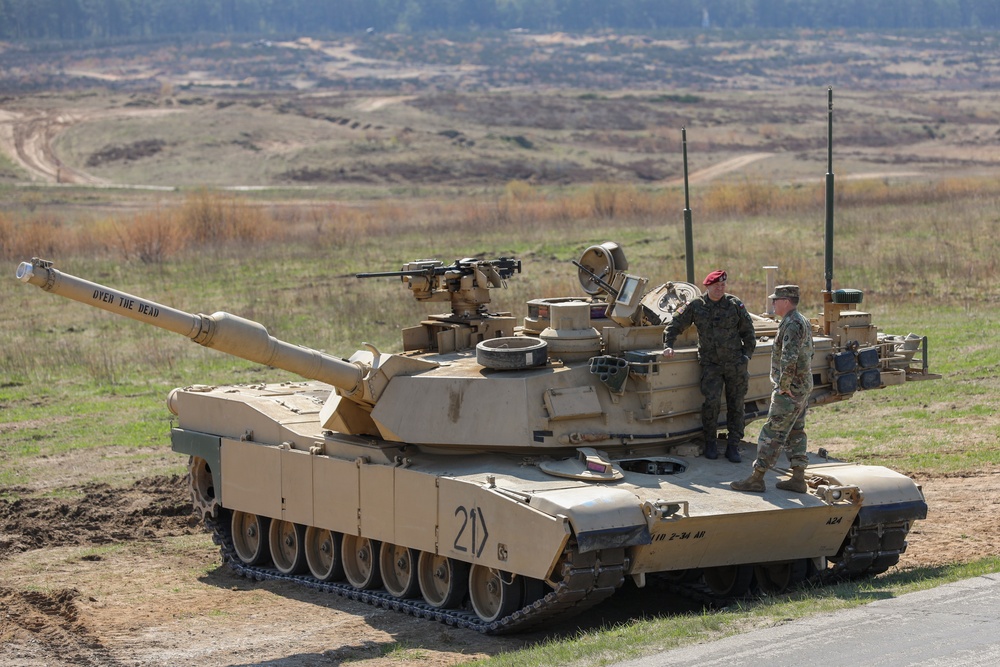 Polish and U.S. Soldiers Watch a Combined Arms Breach During Abrams Operation Summit