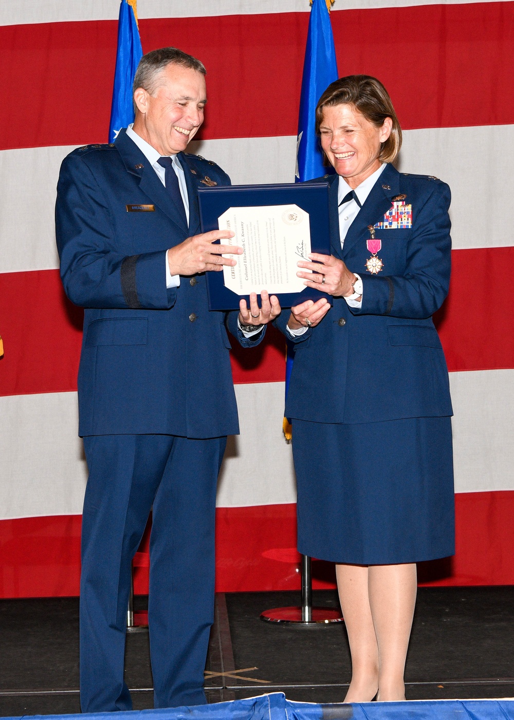 Col. Beth Kwasny accepts Certificate of Retirement