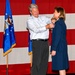 Husband, James Kwasny pins retirement pin on his wife, Col. Beth Kwasny