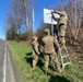 104th Fighter Wing members put up sign