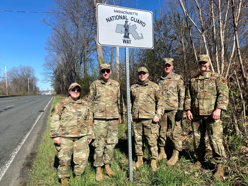 104th Fighter Wing members put up sign