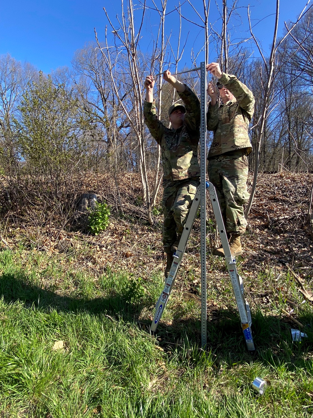 104th Fighter Wing members put up sign