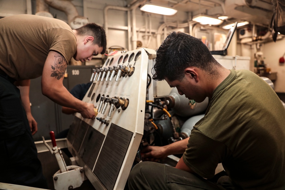 Abraham Lincoln Sailors conduct aircraft maintenance